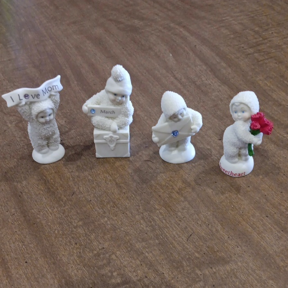 Set of Four White Snowbaby Figurines